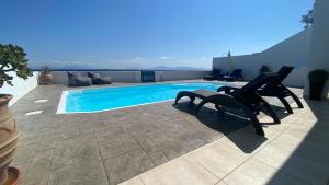 The swimming pool at or close to NV seafront villa Aegina 1