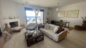 A seating area at NV seafront villa Aegina 1