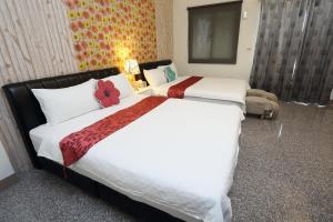 Łóżko lub łóżka w pokoju w obiekcie Fish House Hostel