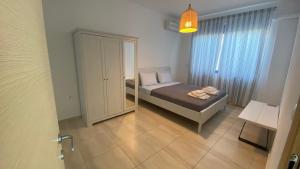 A bed or beds in a room at NV seafront villa Aegina 1 Még 24 kép