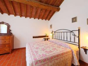 a bedroom with a bed and a wooden ceiling at Apartment Piano Rosso 1 by Interhome in Marradi