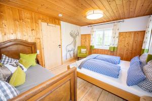Rúm í herbergi á Wuerttemberger Haus - Hütte