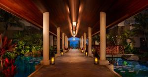 a lobby with a swimming pool and a resort at Montage Kapalua Bay in Kapalua