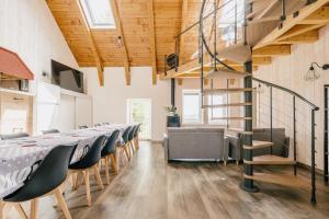 a conference room with a long table and chairs at L'Escapade à la Banut in Jallandrieu