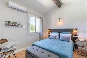 Postel nebo postele na pokoji v ubytování Villa La Roche Rouge