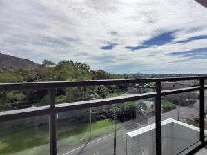a balcony with a view of a road and mountains at 礁溪幸福民宿Jiaoxi Happy Homestay in Jiaoxi