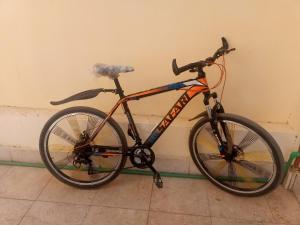 a bike is parked against a wall at Go Inn Backpackers in Aswan