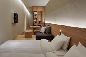 Postel nebo postele na pokoji v ubytování MUJI HOTEL GINZA