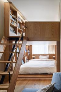 Postel nebo postele na pokoji v ubytování MUJI HOTEL GINZA