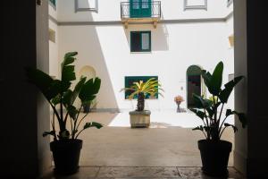 Photo de la galerie de l'établissement Historico Loft & Rooms Palazzo Adragna XIX, à Trapani