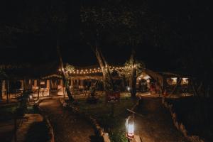 a building with lights on it at night at Mara Olapa Camp in Masai Mara