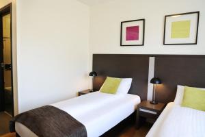 Postelja oz. postelje v sobi nastanitve Fosshotel Westfjords
