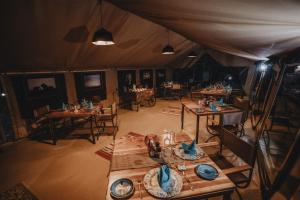 an overhead view of a tent with tables and chairs at Mara Olapa Camp in Masai Mara