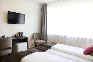 Postelja oz. postelje v sobi nastanitve Fosshotel Westfjords