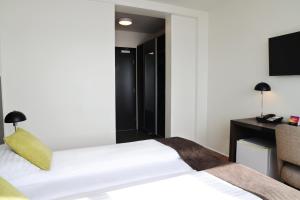 Postelja oz. postelje v sobi nastanitve Fosshotel Westfjords