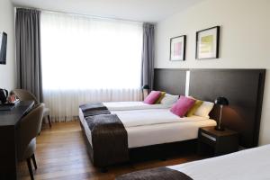 Postelja oz. postelje v sobi nastanitve Fosshotel Westfjords