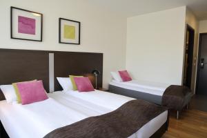 Postelja oz. postelje v sobi nastanitve Fosshotel Westfjords