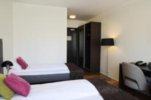 Postelja oz. postelje v sobi nastanitve Fosshotel Westfjords