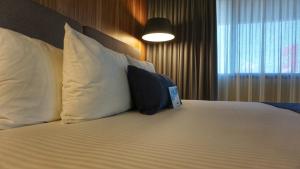 Säng eller sängar i ett rum på Comfort Inn Córdoba