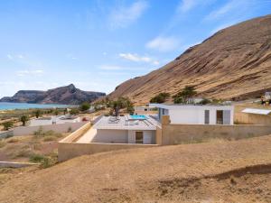 a house in the middle of a desert with a hill at Casa do Azimute by Real Vision in Porto Santo