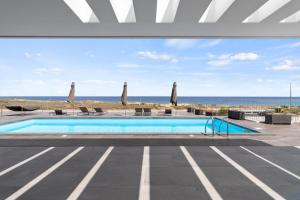 a swimming pool with a view of the beach at Casa do Azimute by Real Vision in Porto Santo