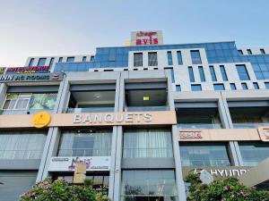 a building with a sign on the front of it at HOTEL AVENUE AC ROOMS in Ahmedabad