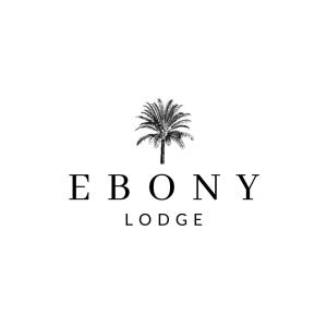 姆塔塔的住宿－Ebony Lodge，白色背景上的棕榈树标志