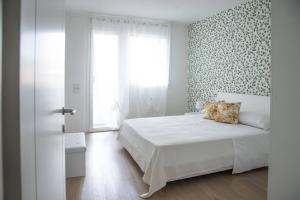 Posteľ alebo postele v izbe v ubytovaní Appartamenti Scrovegni