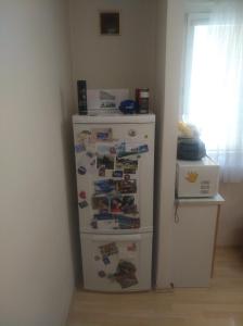 a refrigerator in a corner of a room at Byt 2+1 s balkonem in Vsetín