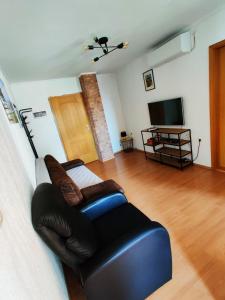 TV a/nebo společenská místnost v ubytování Sanda Residence