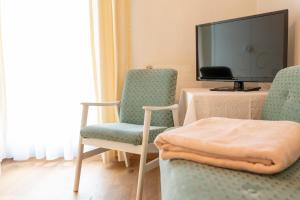 Μια τηλεόραση ή/και κέντρο ψυχαγωγίας στο Hotel Garni Keil