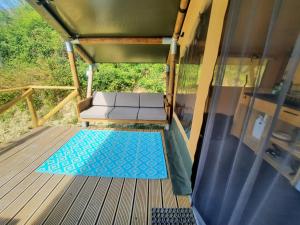 a view from the inside of a gazebo with a bench on at casavistafiore in Montefiore dellʼAso