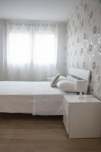 Posteľ alebo postele v izbe v ubytovaní Appartamenti Scrovegni