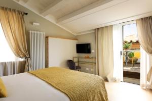 Postel nebo postele na pokoji v ubytování Sui Tetti di Balarm Boutique Rooms