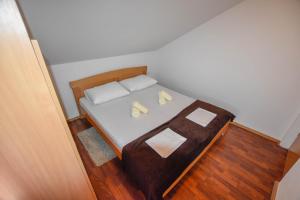 Postel nebo postele na pokoji v ubytování Apartments Kalista