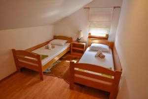 Postel nebo postele na pokoji v ubytování Apartments Kalista
