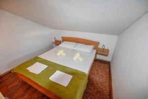 Postel nebo postele na pokoji v ubytování Apartments Kalista