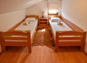 Postel nebo postele na pokoji v ubytování Apartments Kalista