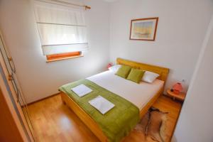 Postel nebo postele na pokoji v ubytování Apartments Kalista