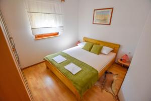 Postel nebo postele na pokoji v ubytování Apartments Kalista