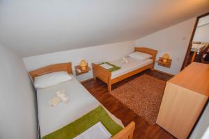 Postel nebo postele na pokoji v ubytování Apartments Kalista