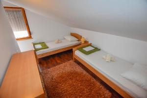 Postel nebo postele na pokoji v ubytování Apartments Kalista