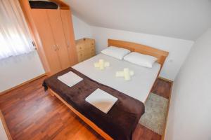 Postel nebo postele na pokoji v ubytování Apartments Kalista