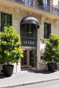 a building with a la chef sign on it at La Clef Tour Eiffel Paris by The Crest Collection in Paris