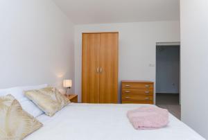 Postel nebo postele na pokoji v ubytování Apartments and Rooms Bianca