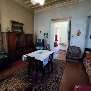a living room with a table and a couch at Renting a full apartment in the centre of Gyumri in Gyumri