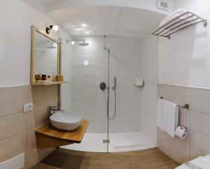 a bathroom with a sink and a shower at Hotel I Graniti in Villasimius