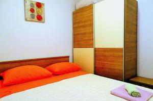 Łóżko lub łóżka w pokoju w obiekcie Apartments Graciela