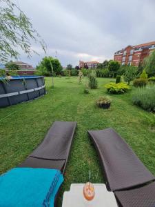 a view of a yard with a swimming pool at Green Villa Rodna in Skopje