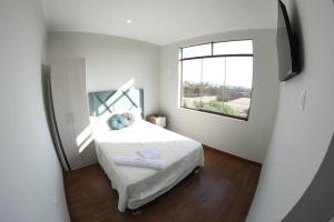 En eller flere senge i et værelse på ENCANTADORA Casa de Campo - Ica